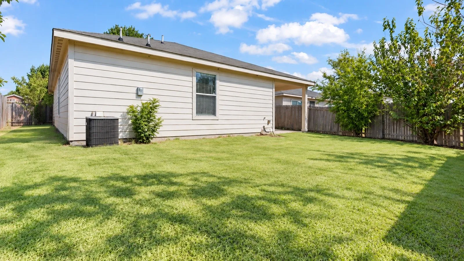 Backyard, *please note, enhanced photo to show green grass*