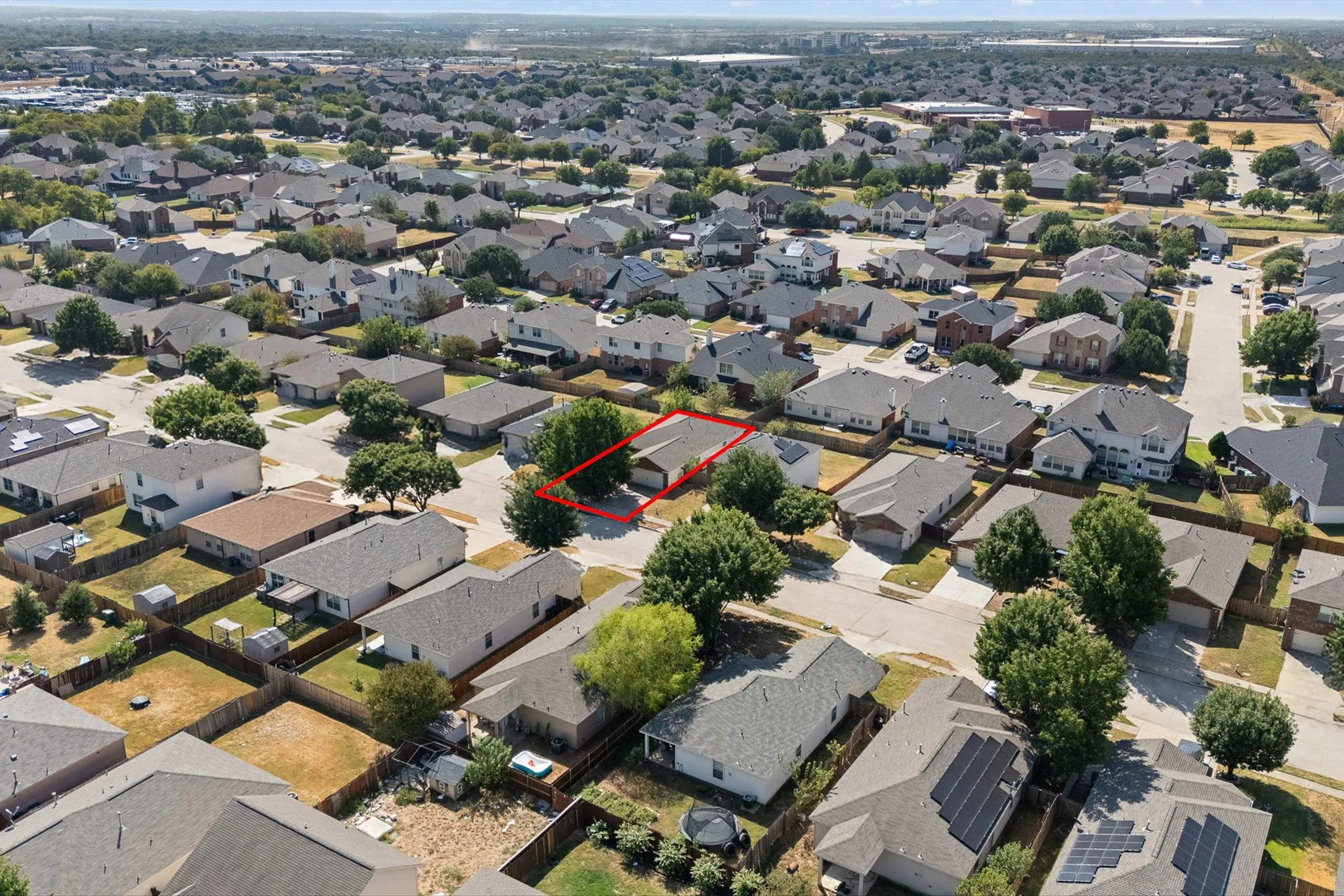 Aerial view of the house, outlined in red