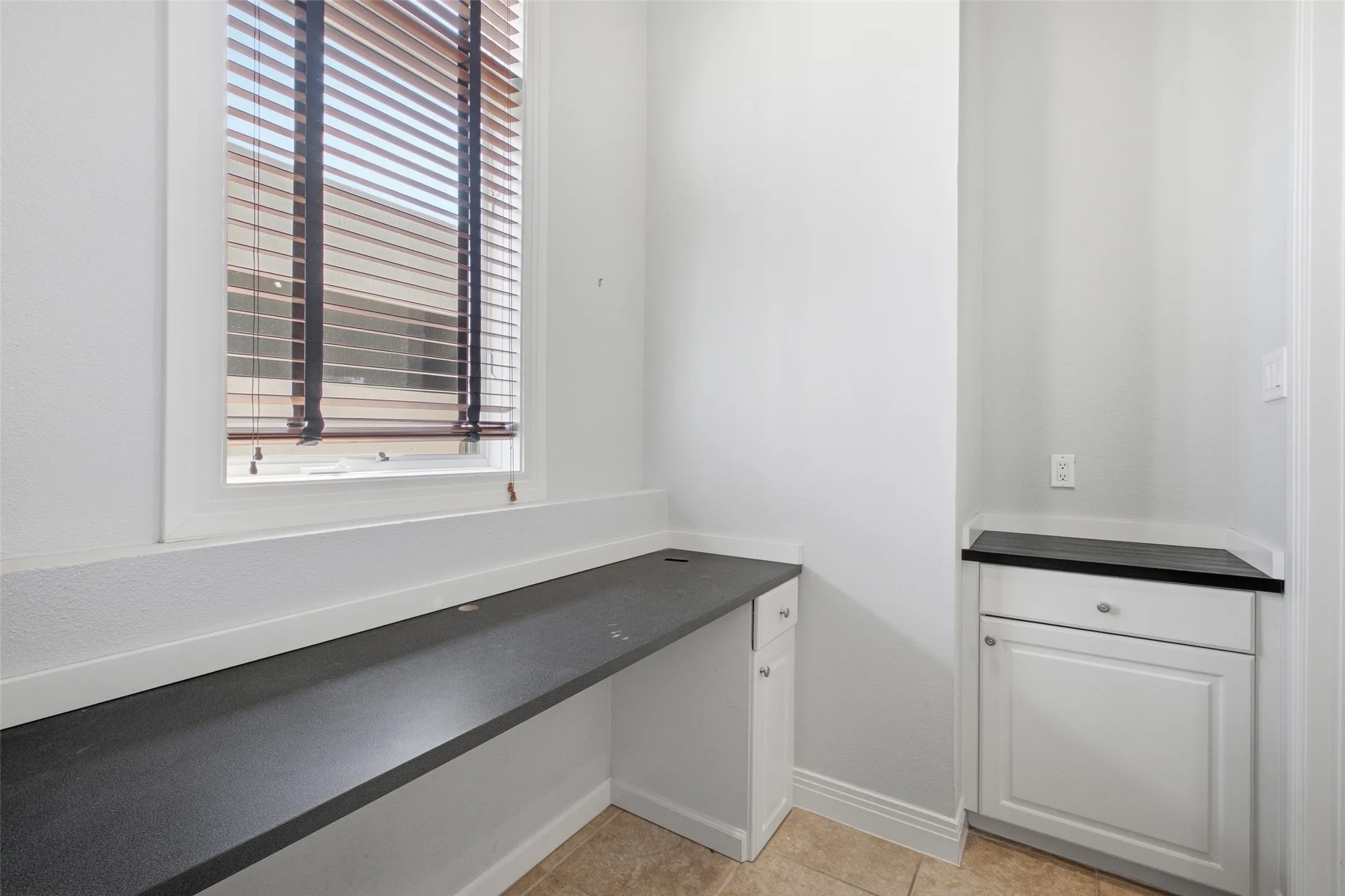 A built-in desk nook off the kitchen - a work-from-home spot that costs you zero bedrooms