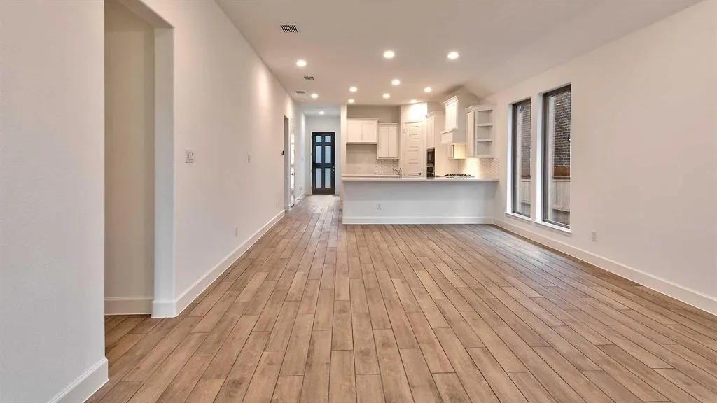 Wood-finish plank flooring throughout