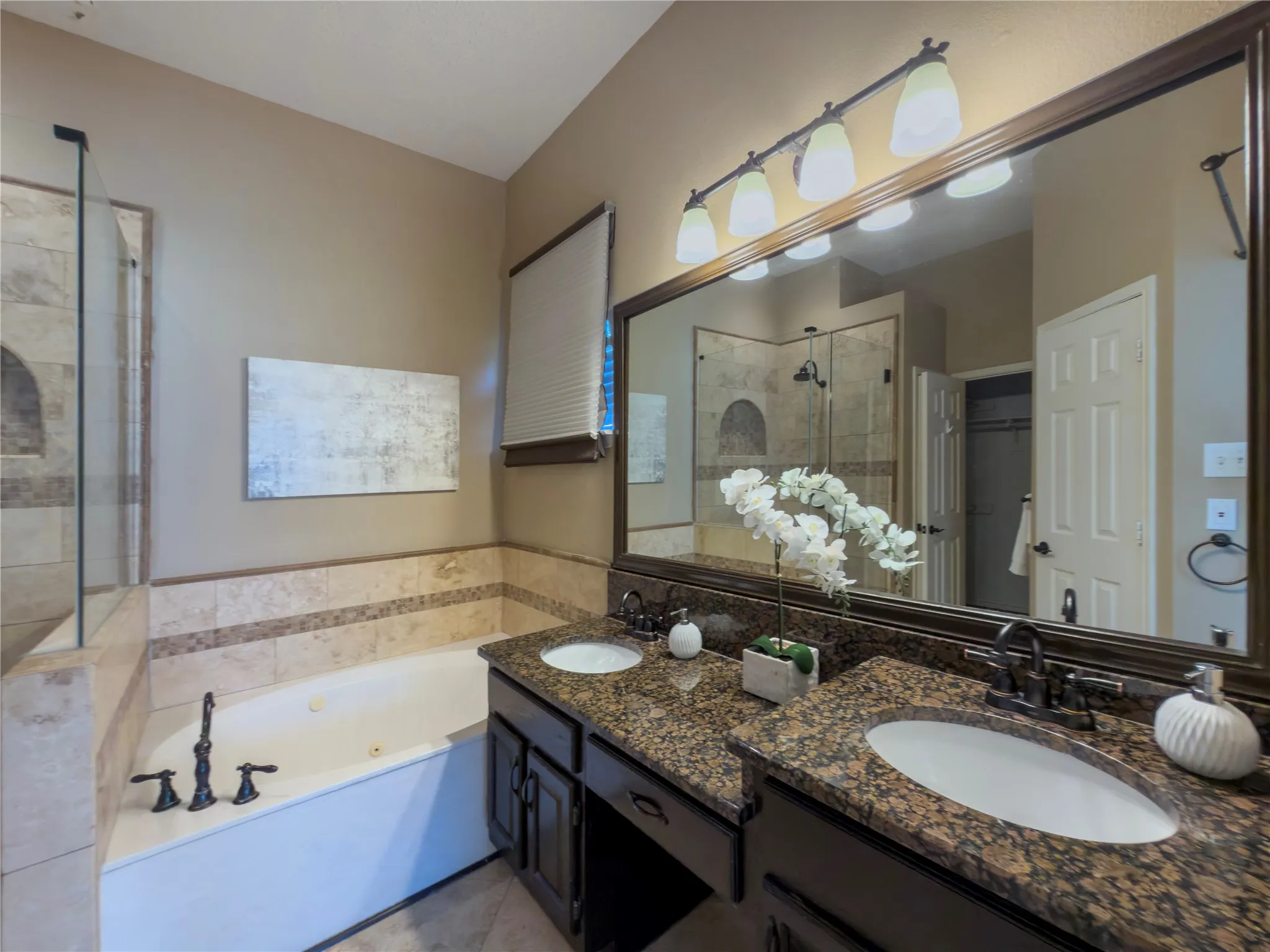 Dual vanity with undermount sinks and granite-style countertops