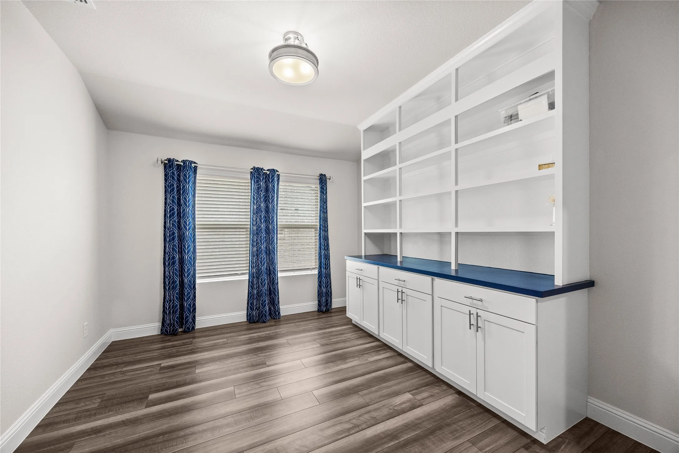 Office with Sliding door shelfs and cabinets
