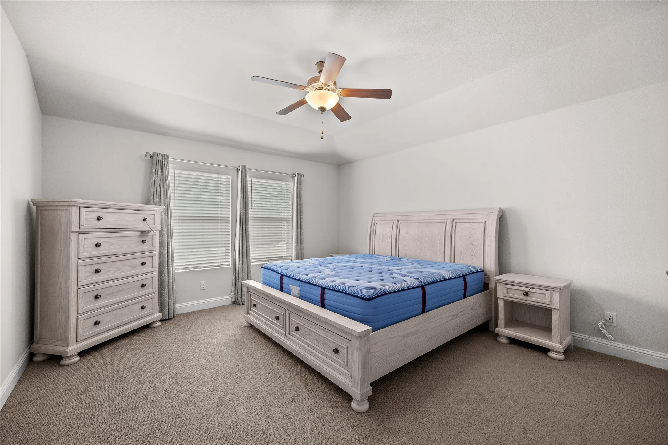 Neutral-toned wall paint and carpeted flooring