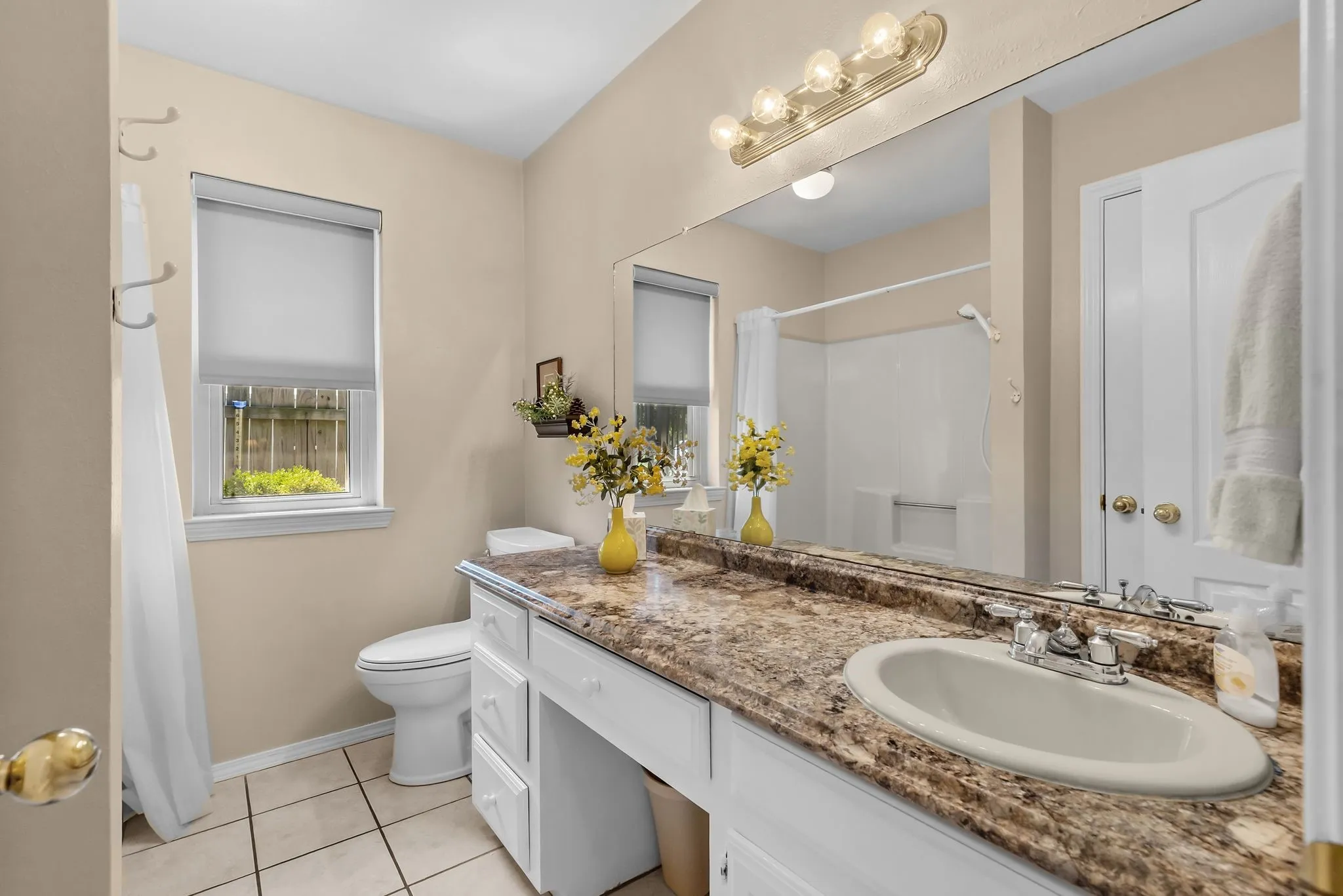 Hall bath has tub shower combo
