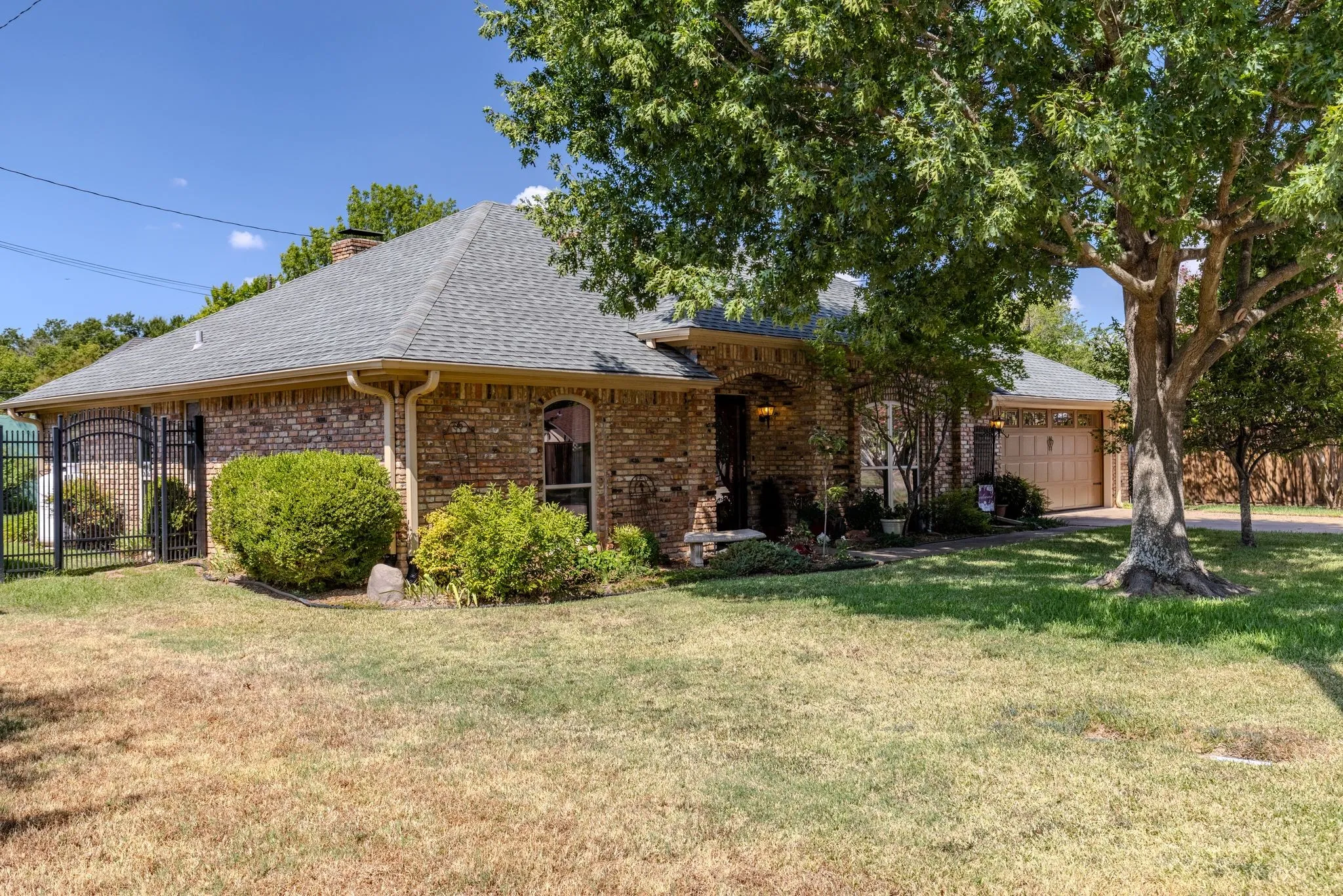 Lawn has full sprinkler system, leaf-guard gutters, 2018 roof