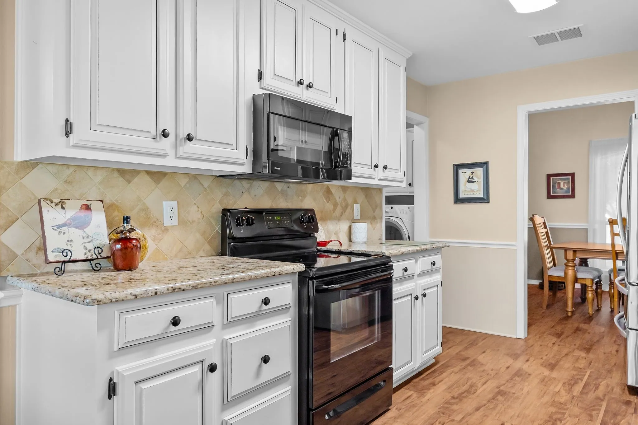 Granite tops, beautiful painted cabinets, kitchen is open to breakfast room as well as dining room