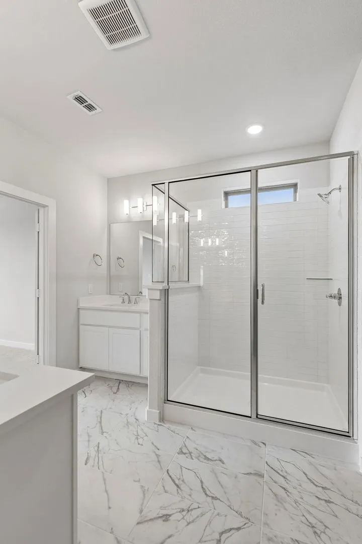 Primary Bathroom in the Winters home plan by Trophy Signature Homes – REPRESENTATIVE PHOTO