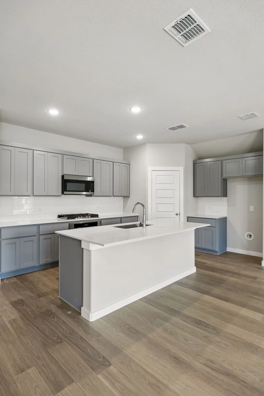 Kitchen in the Emmy II home plan by Trophy Signature Homes - REPRESENTATIVE PHOTO