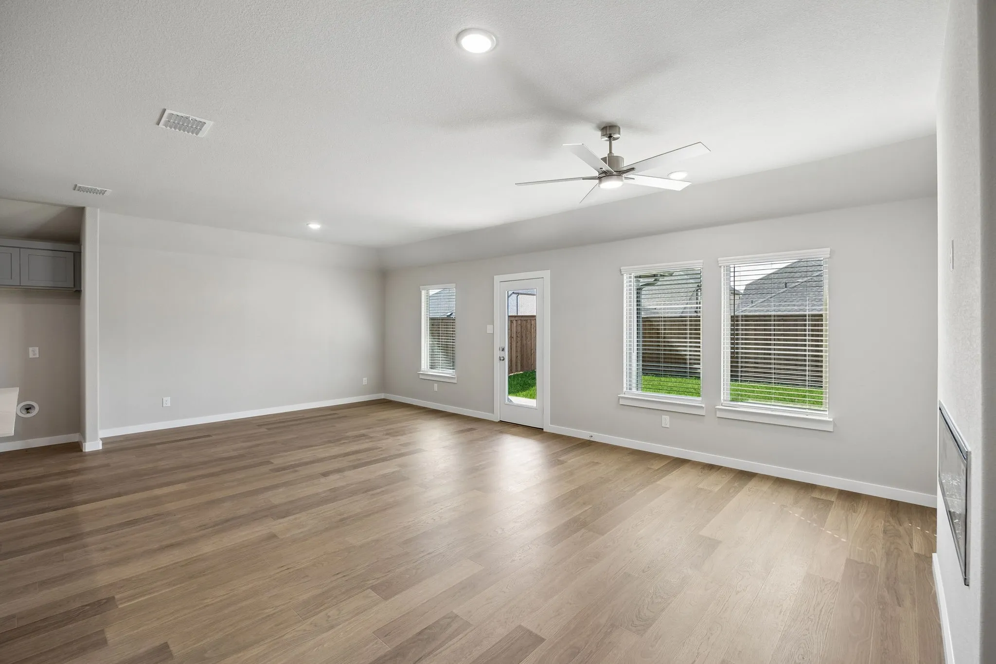 Living and Dining Room in the Emmy II home plan by Trophy Signature Homes - REPRESENTATIVE PHOTO
