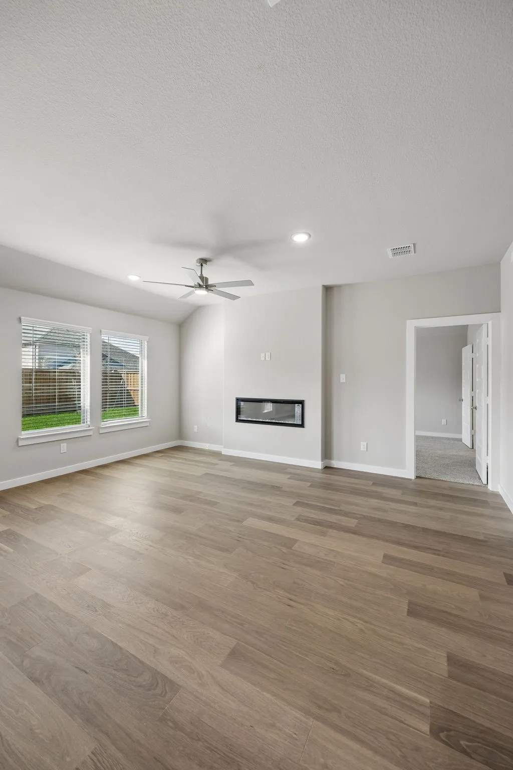 Living Room in the Emmy II home plan by Trophy Signature Homes - REPRESENTATIVE PHOTO