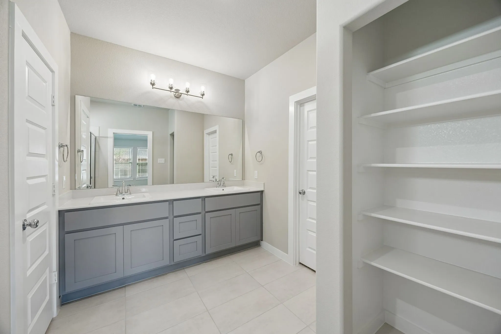 Primary Bathroom in the Emmy II home plan by Trophy Signature Homes - REPRESENTATIVE PHOTO