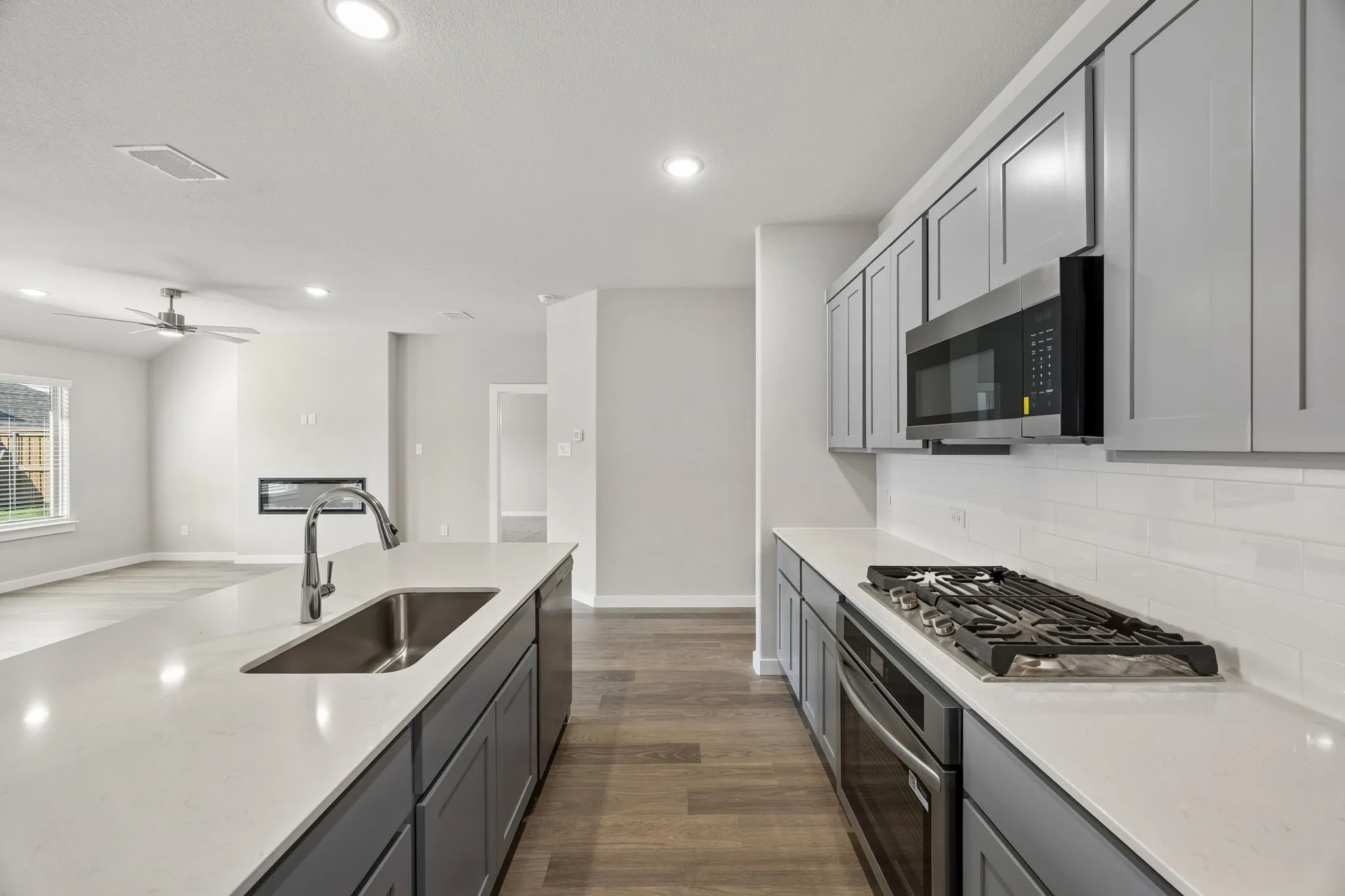 Kitchen in the Emmy II home plan by Trophy Signature Homes - REPRESENTATIVE PHOTO