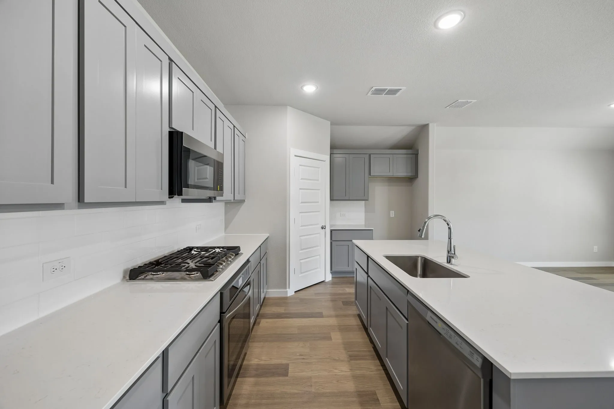 Kitchen in the Emmy II home plan by Trophy Signature Homes - REPRESENTATIVE PHOTO