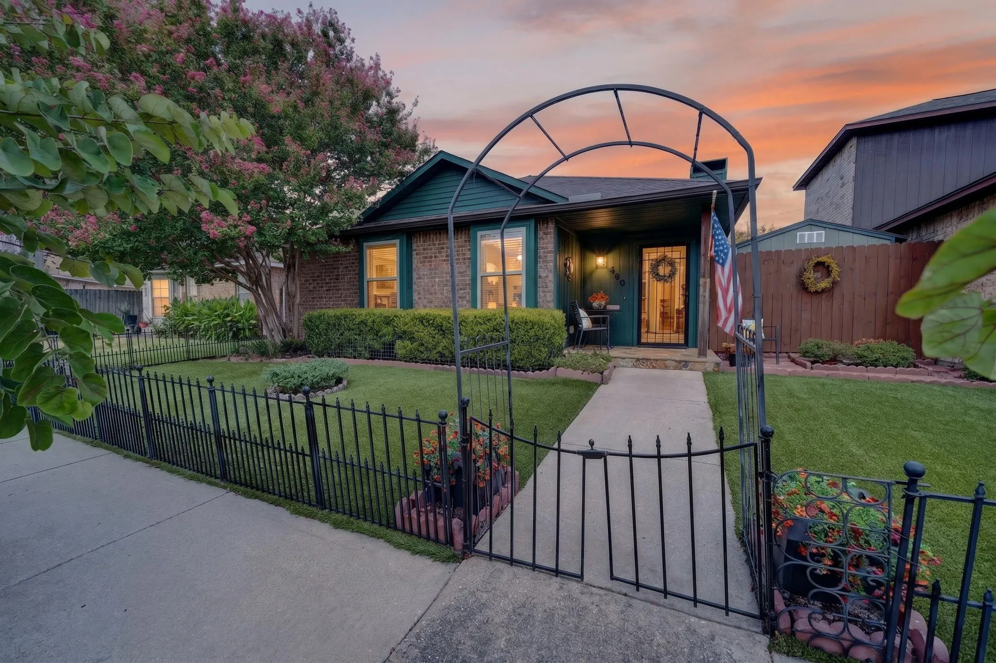 Brick and siding exterior with a covered porch entry