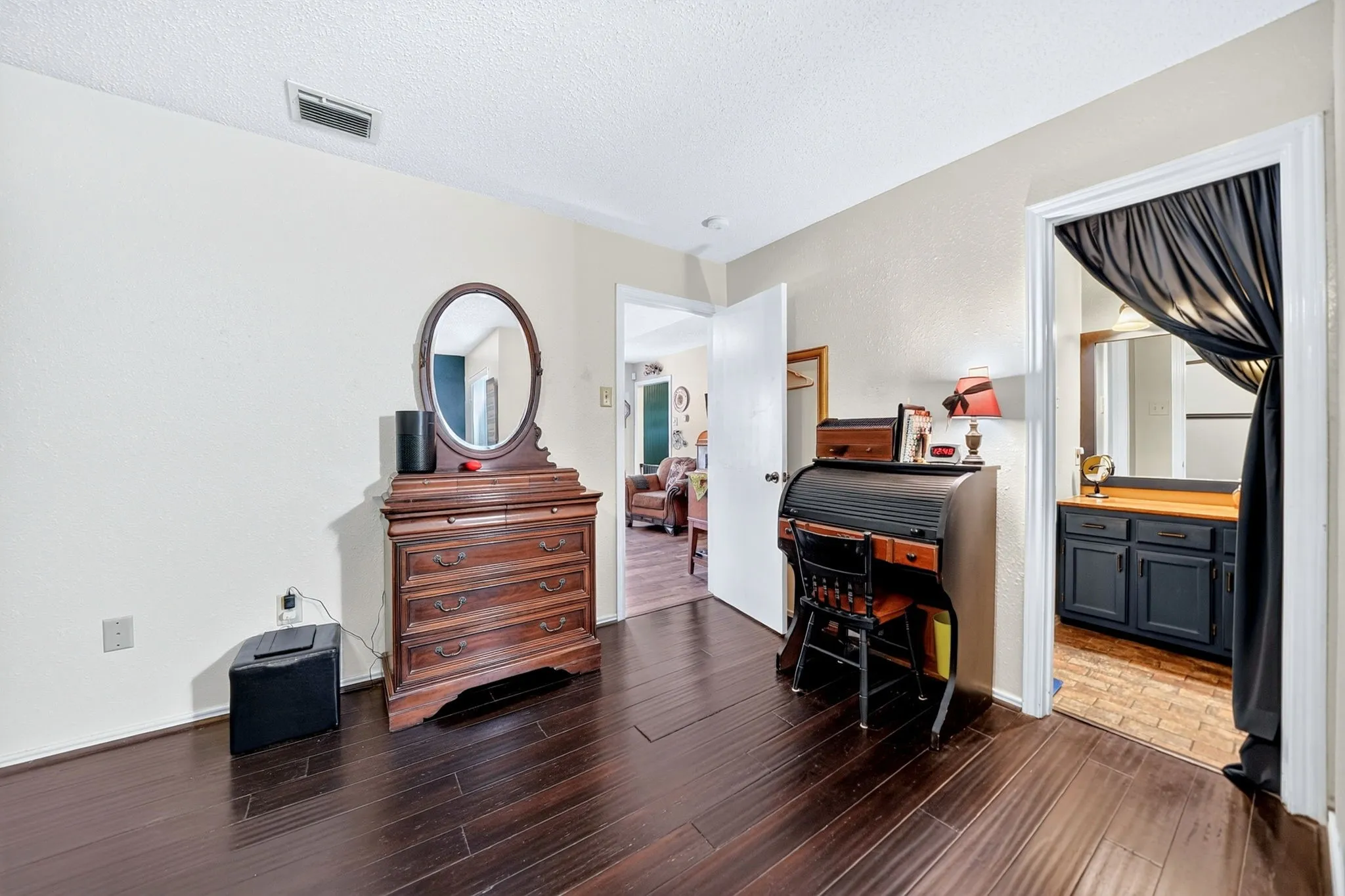 Dark wood-finish flooring throughout