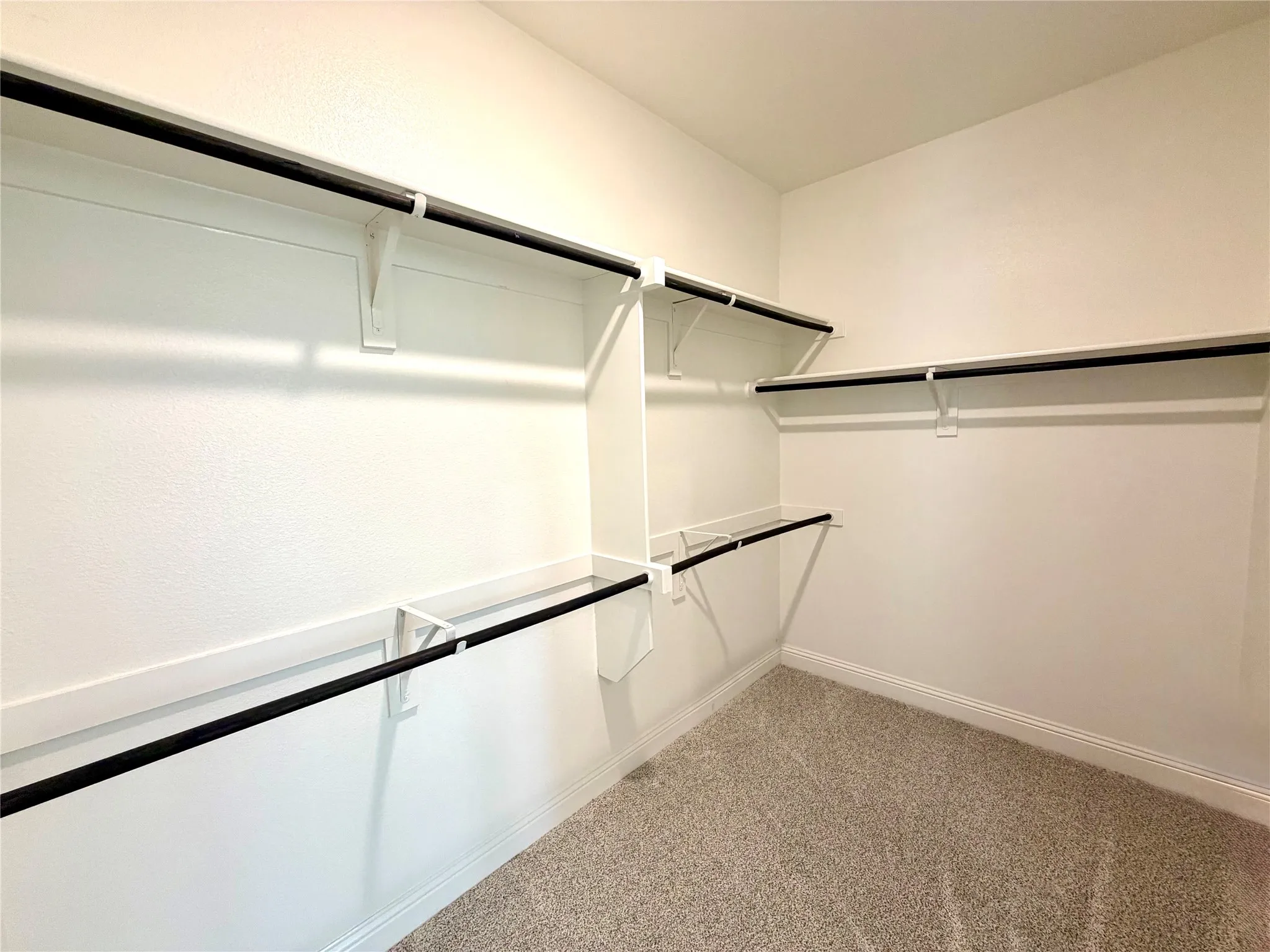 Spacious primary walk-in closet