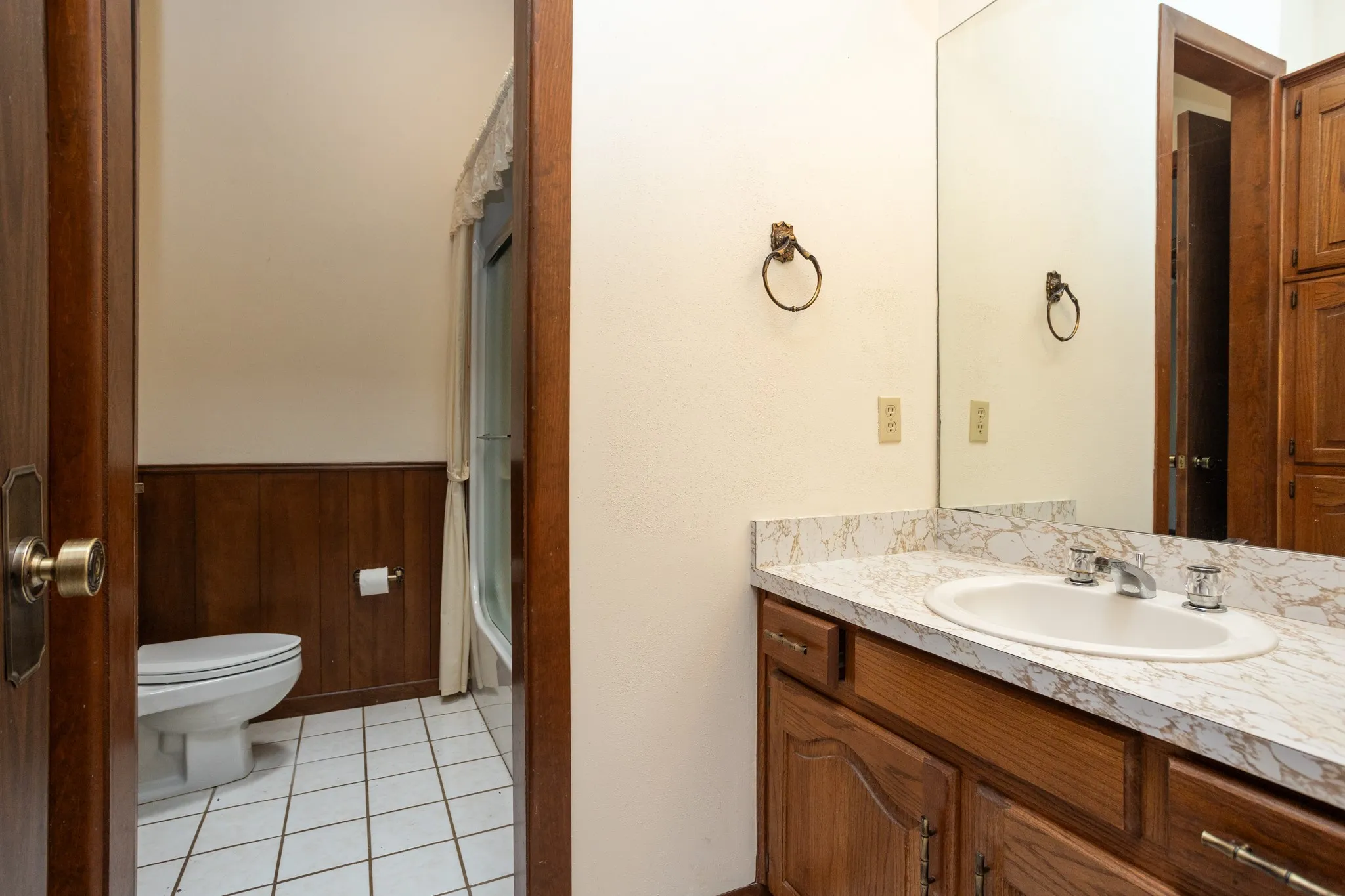 Guest bathroom also opens from hall for guest use.