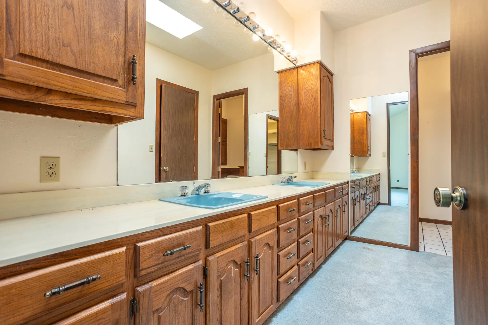 Double vanity with 2 big walk-in closets on the right
