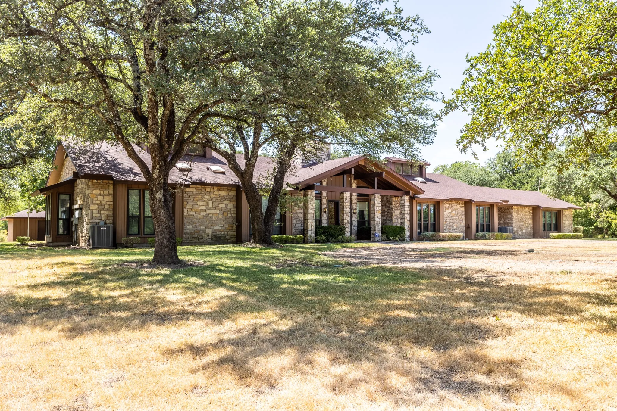 Impressive stone and wood mid-century style located on 22.410 acres
