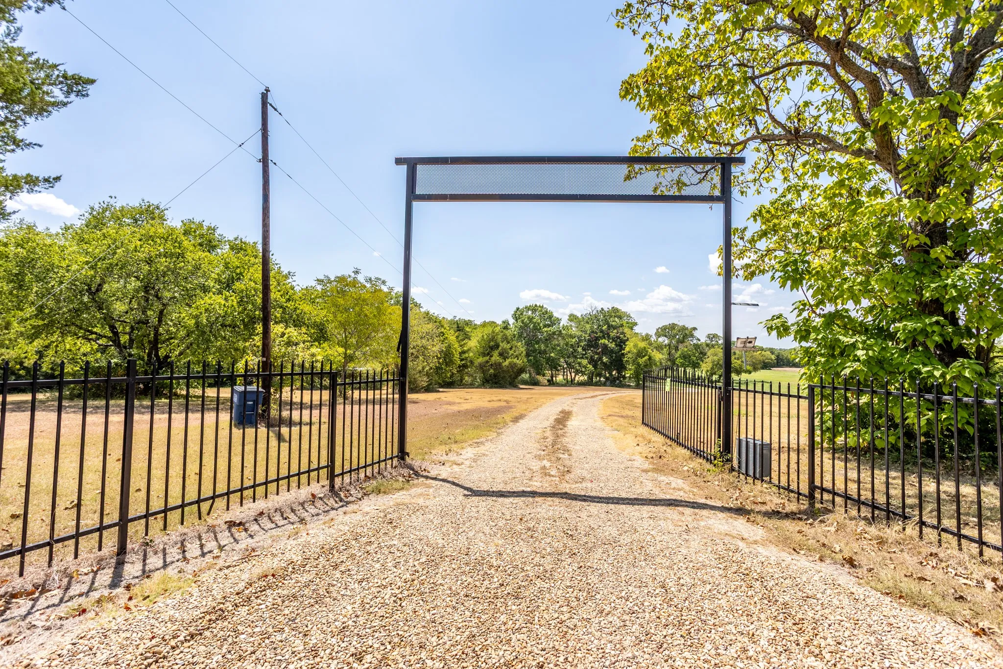 Enter through electric gate and drive to back of property to the home