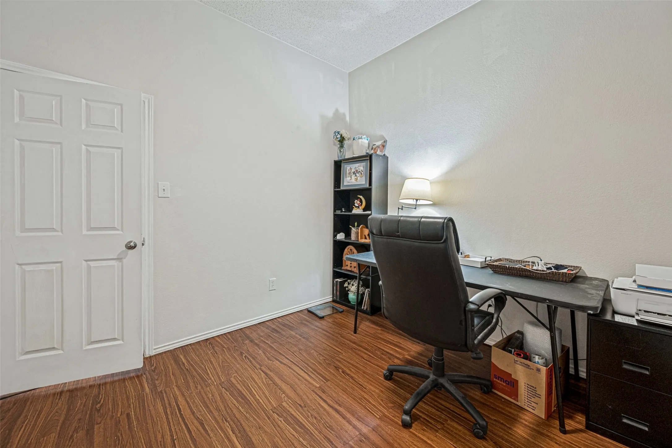 Wood-finish flooring with light-toned wall finishes