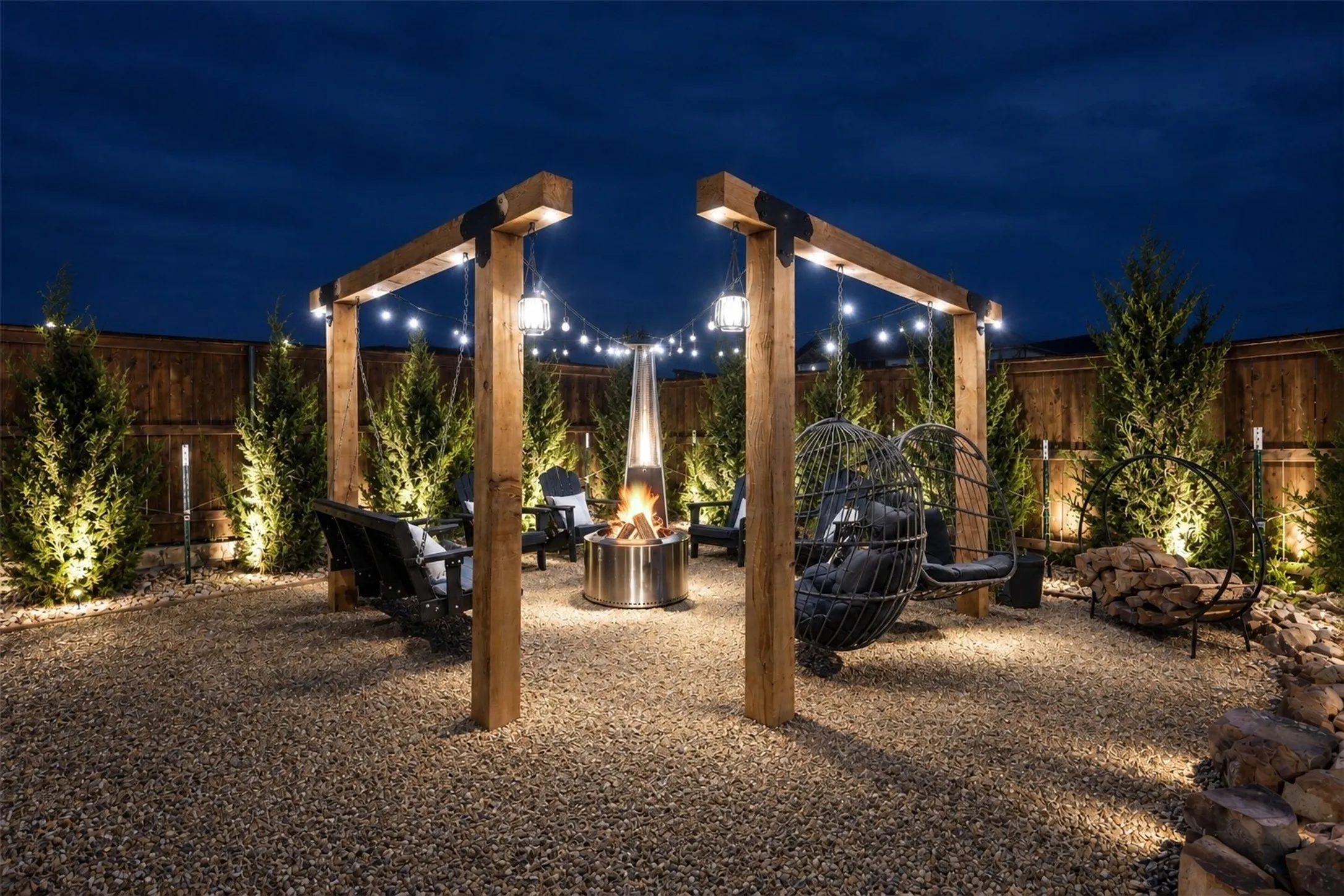 Custom built swing set with lighting and fire pit.