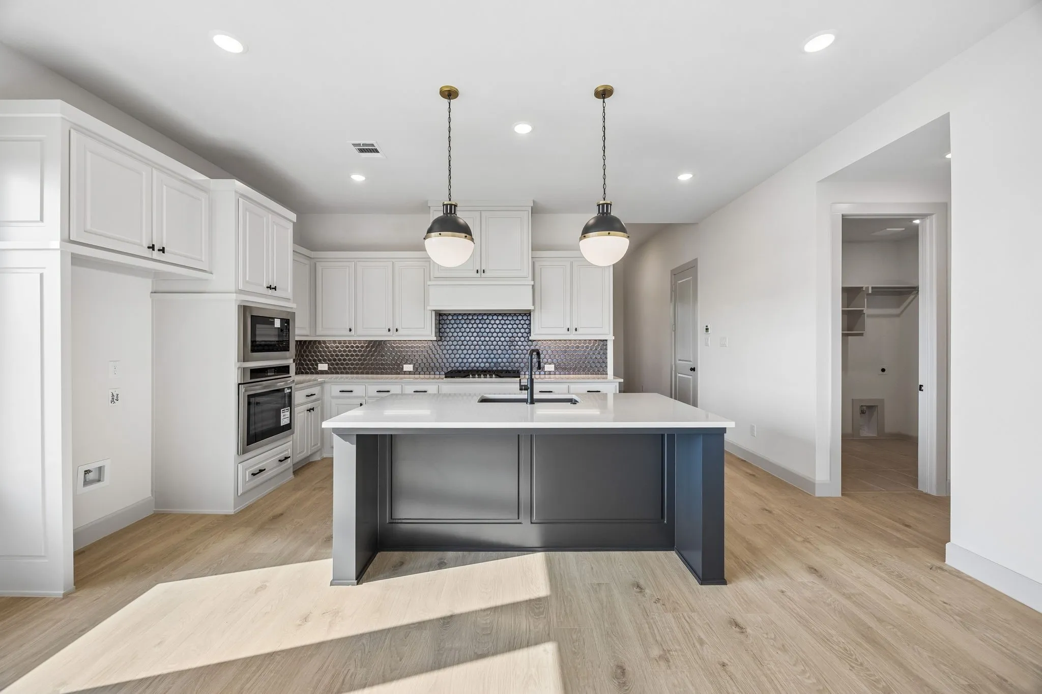 Featuring beautiful cabinetry, gorgeous counter tops, designer backsplash and high end appliances, this dream kitchen offers something for every member of the family!