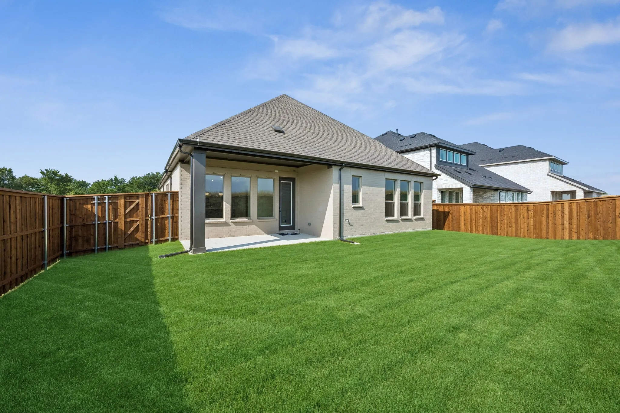 Plenty of fun family bbq's in your future in this fenced back yard with lovely covered patio!