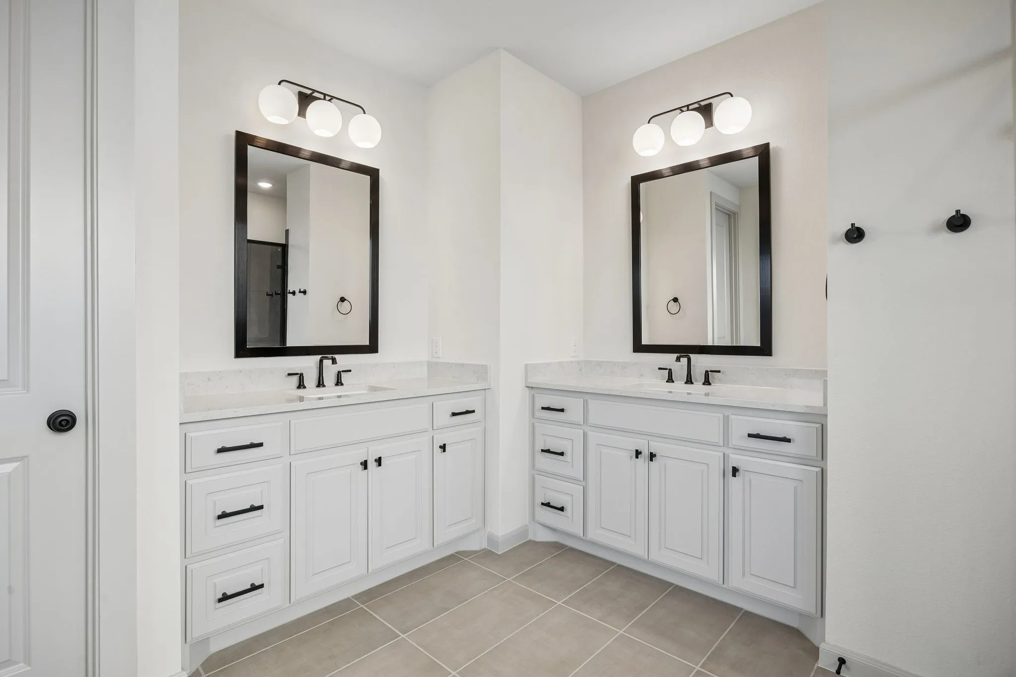 You'll enjoy separate his and hers vanities in this wonderful owner's bath!