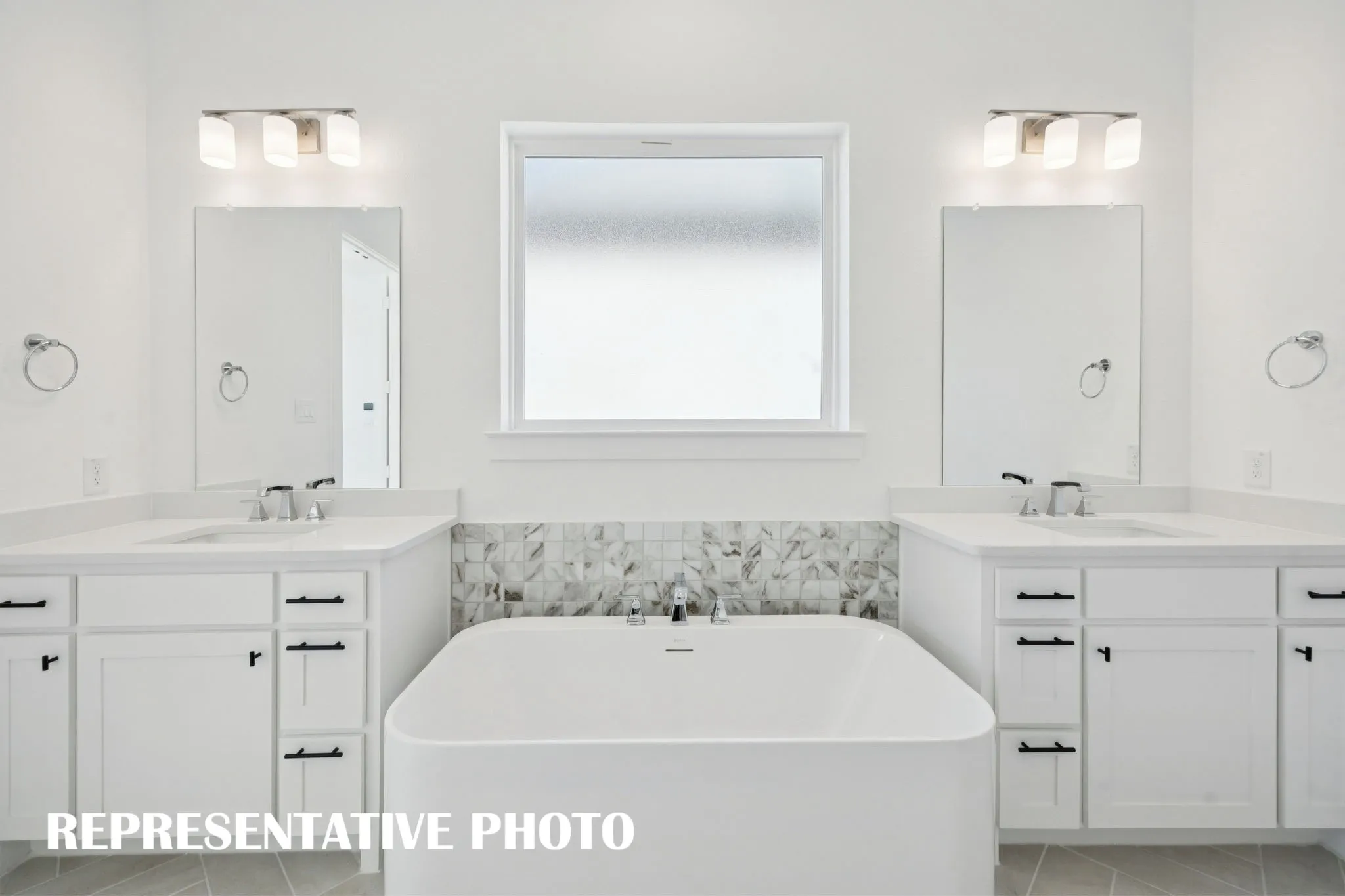 His and her vanities provide ample space for two in this dream owner's bath! REPRESENTATIVE PHOTO
