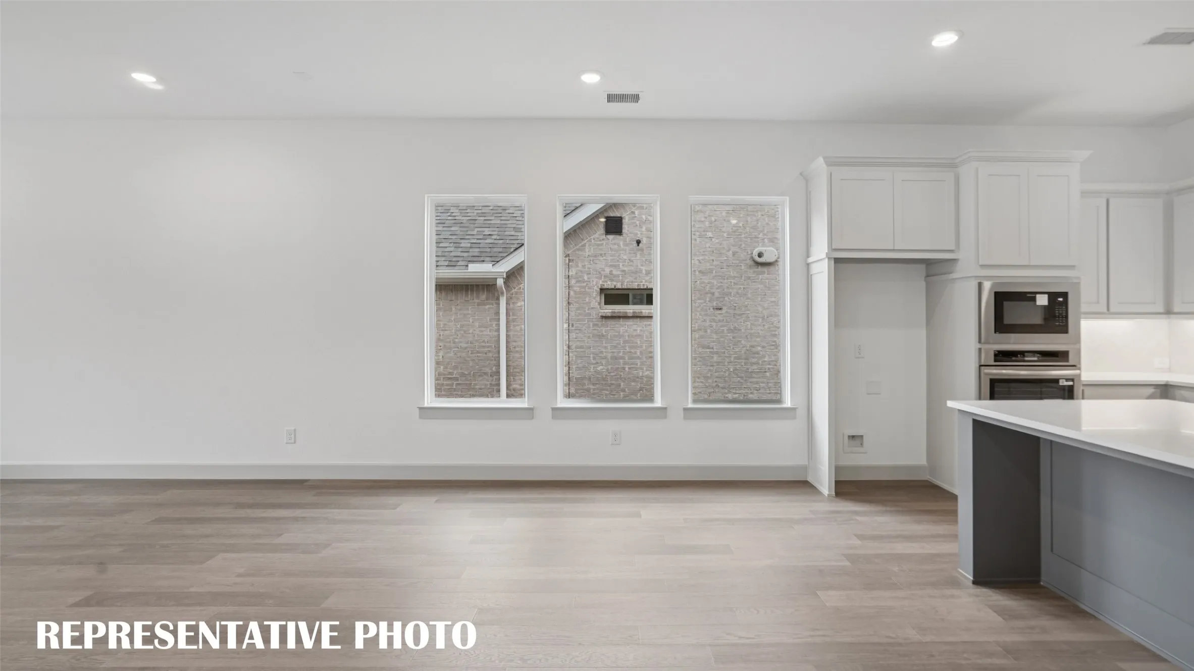 Perfectly located between the kitchen and the family room, this dining room is the ideal space to host lively dinner parties or cozy family gatherings.  REPRESENTATIVE PHOTO
