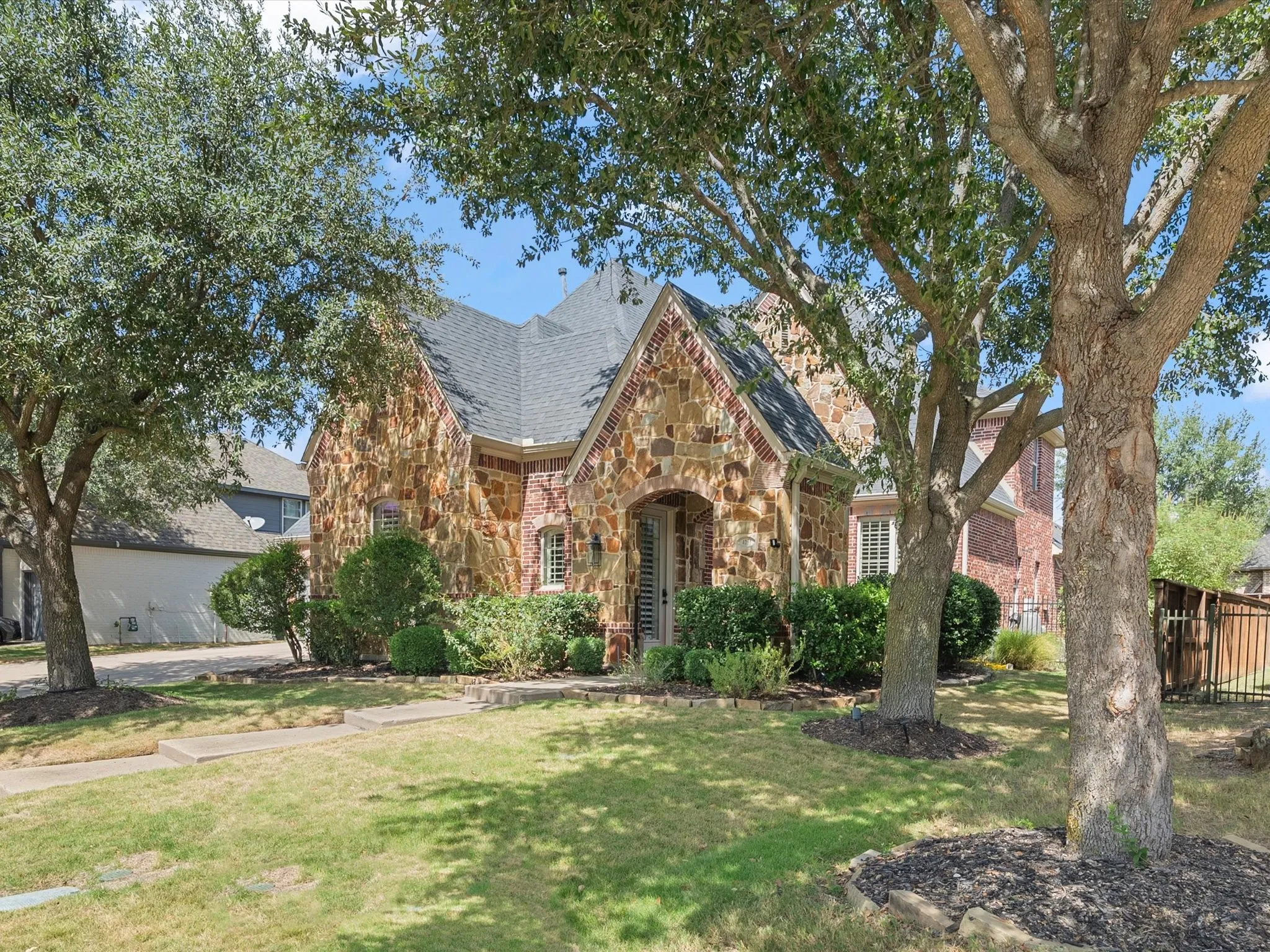 Stone and brick exterior with a gabled roof