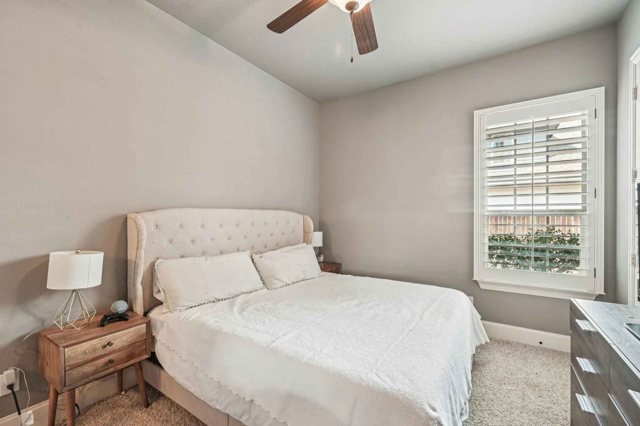 Neutral-toned walls complement plush carpeting