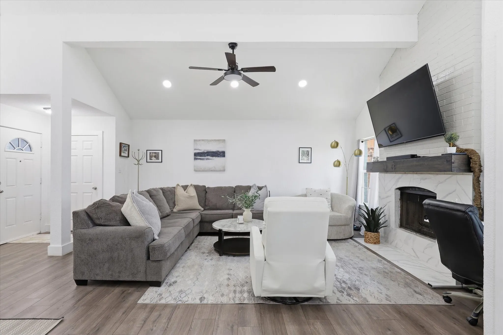 Vaulted ceiling with a ceiling fan and recessed lighting