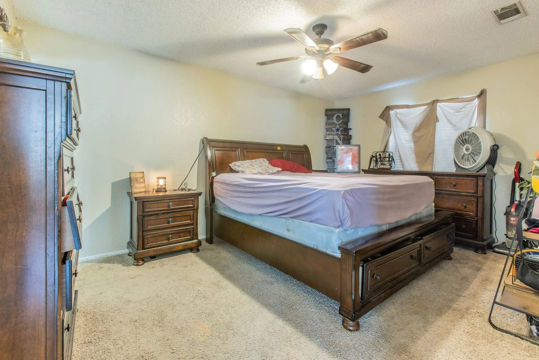 Textured beige carpeting and light-toned walls
