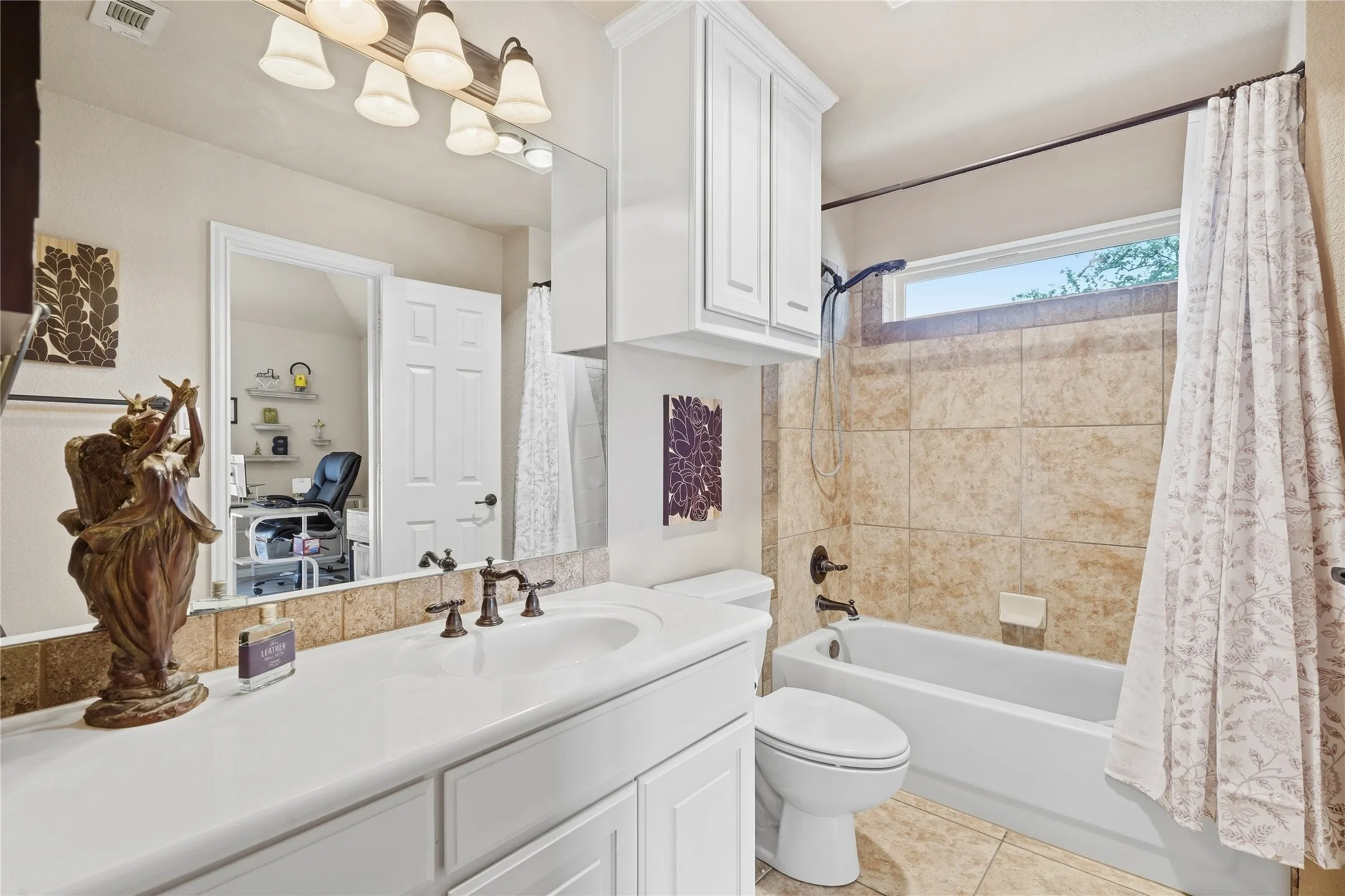 Bathroom off second bedroom, step in tub shower