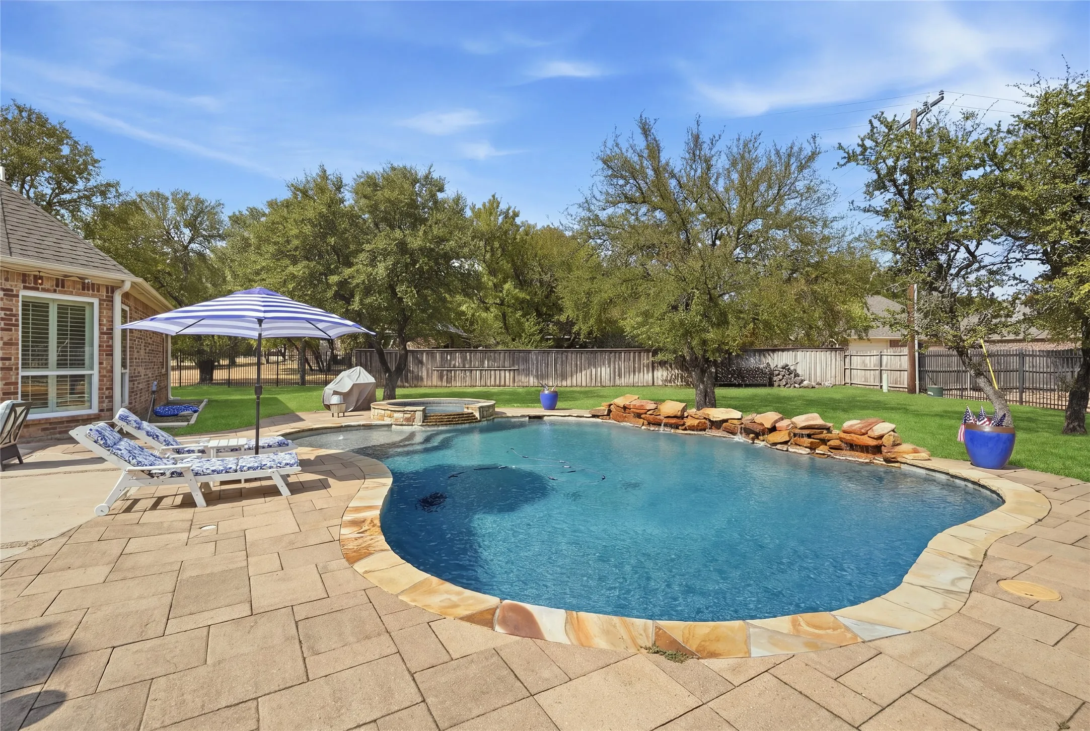The pool, newer, heated waterfall areas for entertaining and an oasis for your family and friends