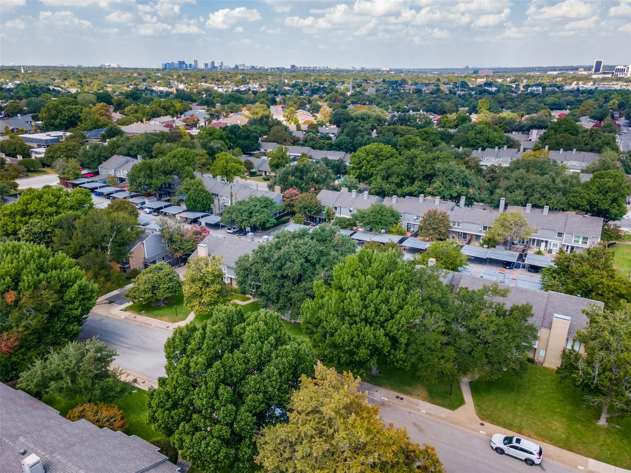 Aerial perspective showcasing residential properties with gray shingle roofs
