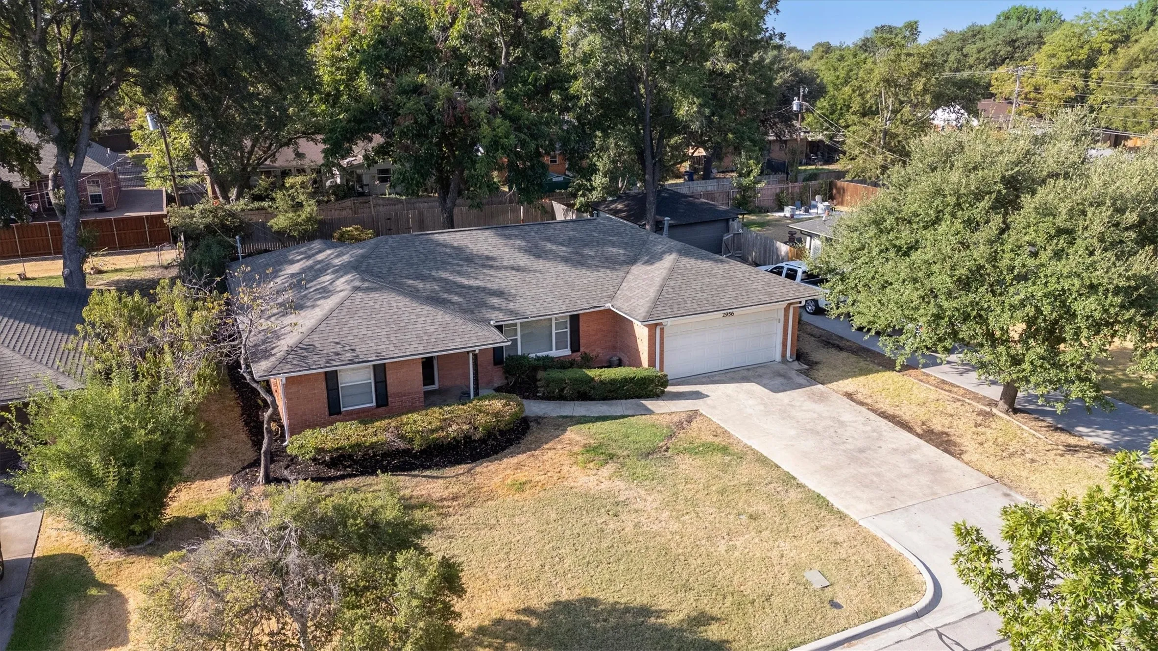 Brick exterior with a gabled roof and attached two-car garage