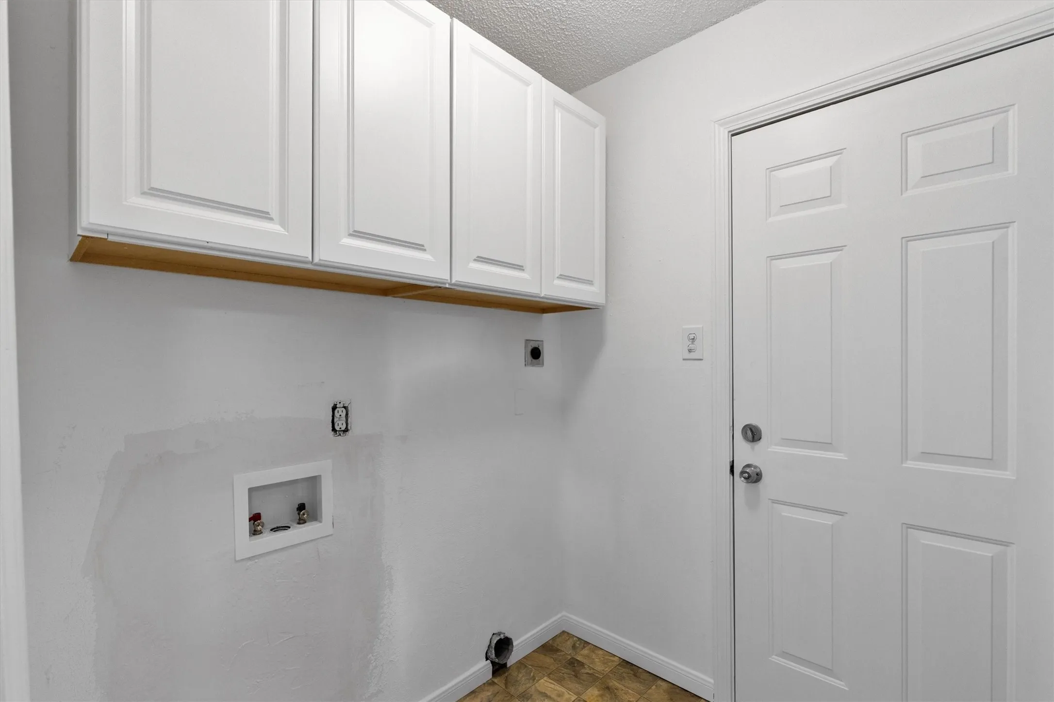 White paneled cabinetry with wood-finish trim