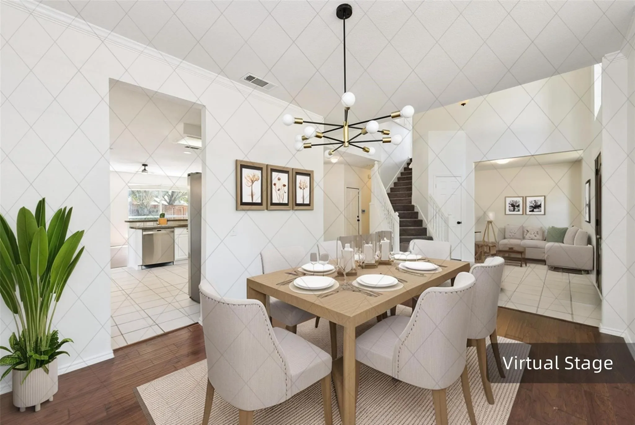 Wood-finish flooring, contemporary chandelier, stainless steel appliances, tiled kitchen flooring, and a staircase with white balusters