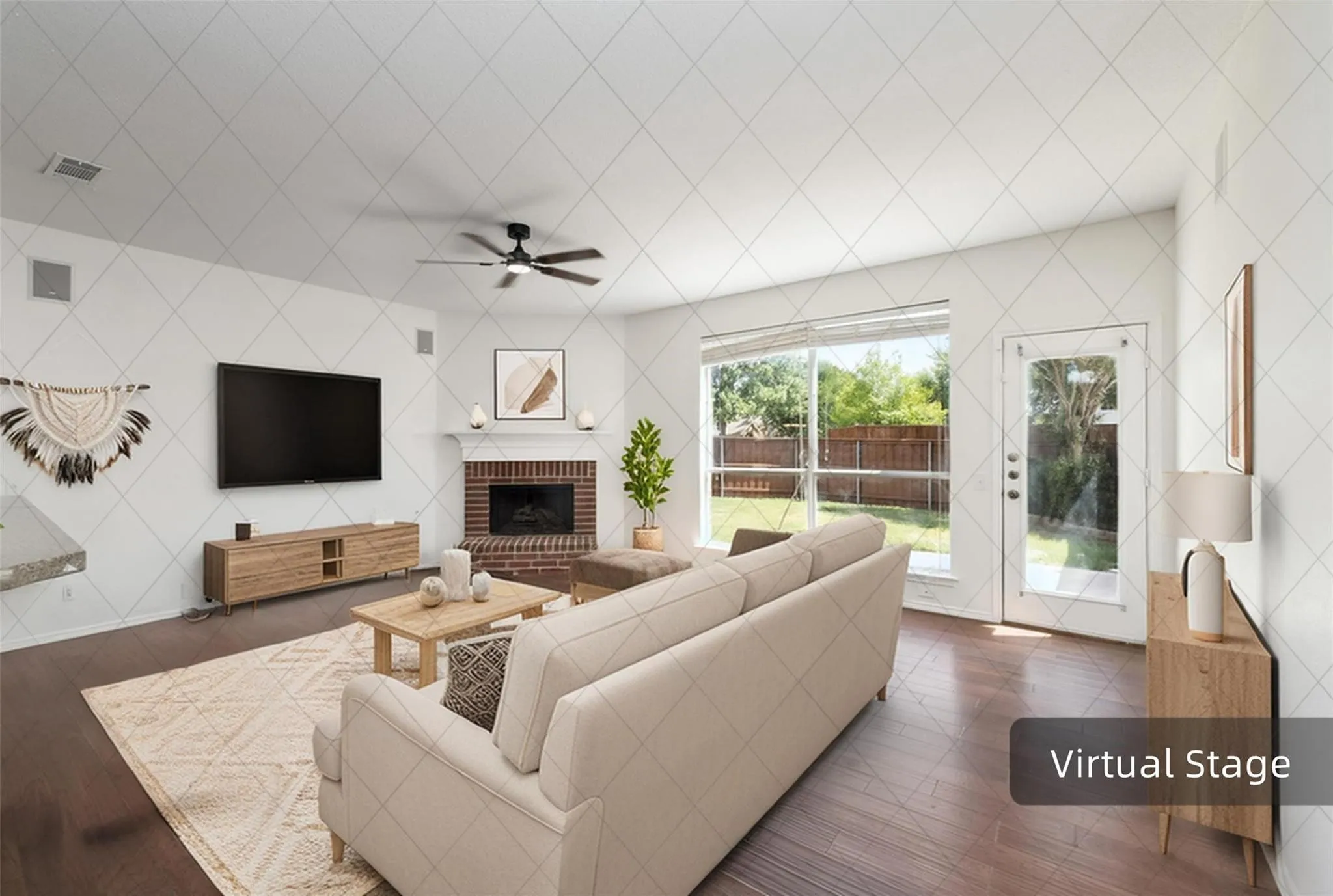 Hardwood-finish flooring, brick fireplace with mantel, ceiling fan with integrated lighting, glass-paneled exterior door, and large window