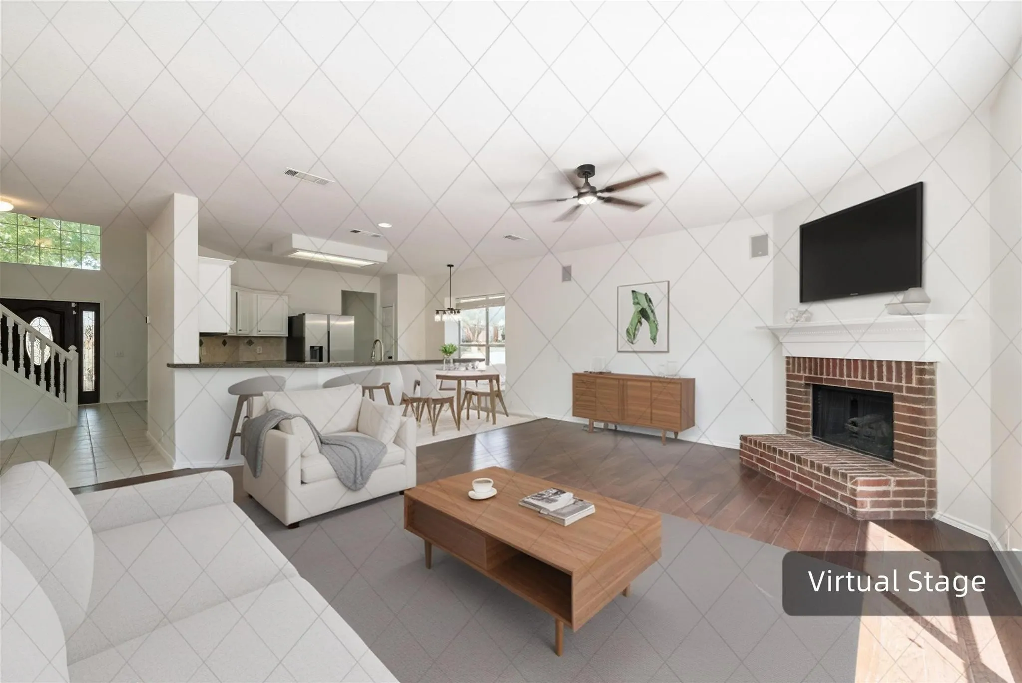Brick fireplace with a substantial hearth and mantel, dark wood-finish flooring, and a ceiling fan