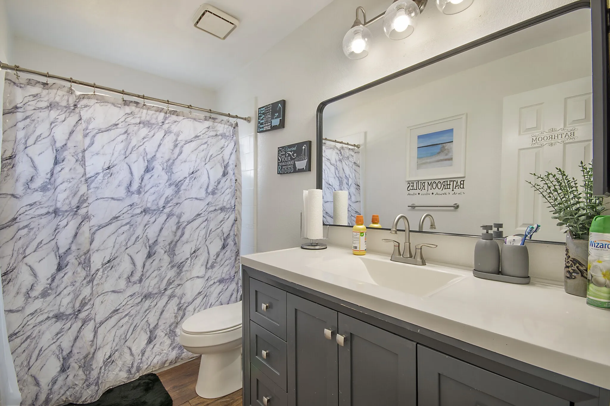 Full bath with vanity and tub-shower.