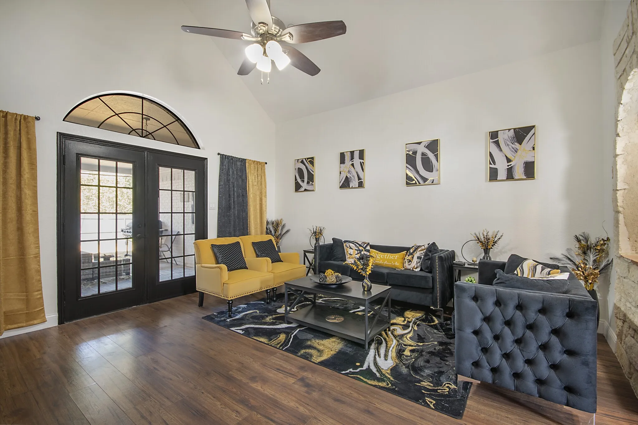 Formal living room with vaulted ceiling and French doors to the back yard.