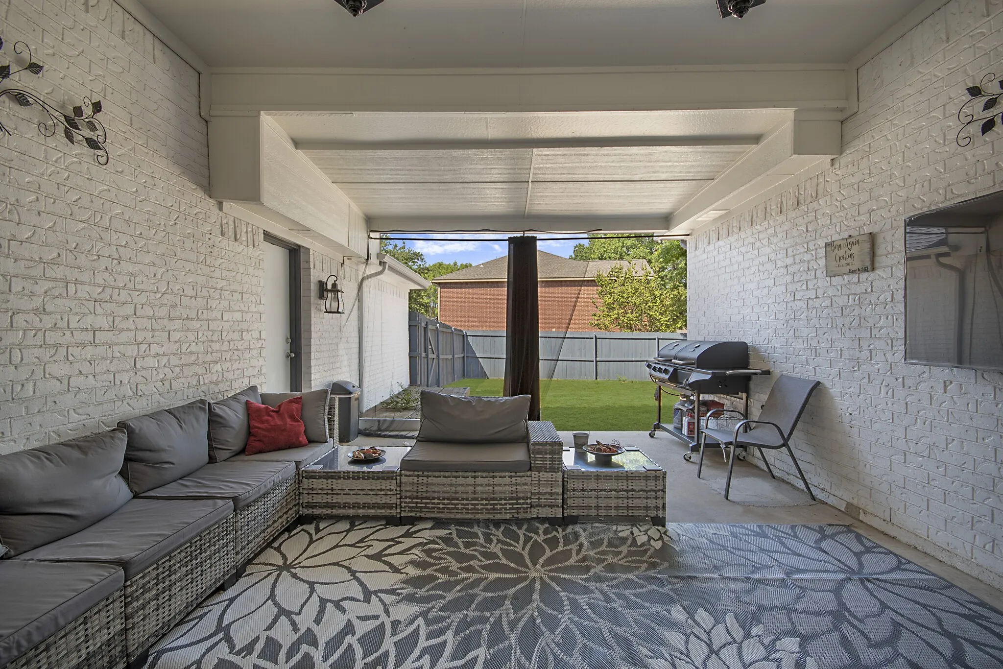 Covered patio looking out over the back yard.