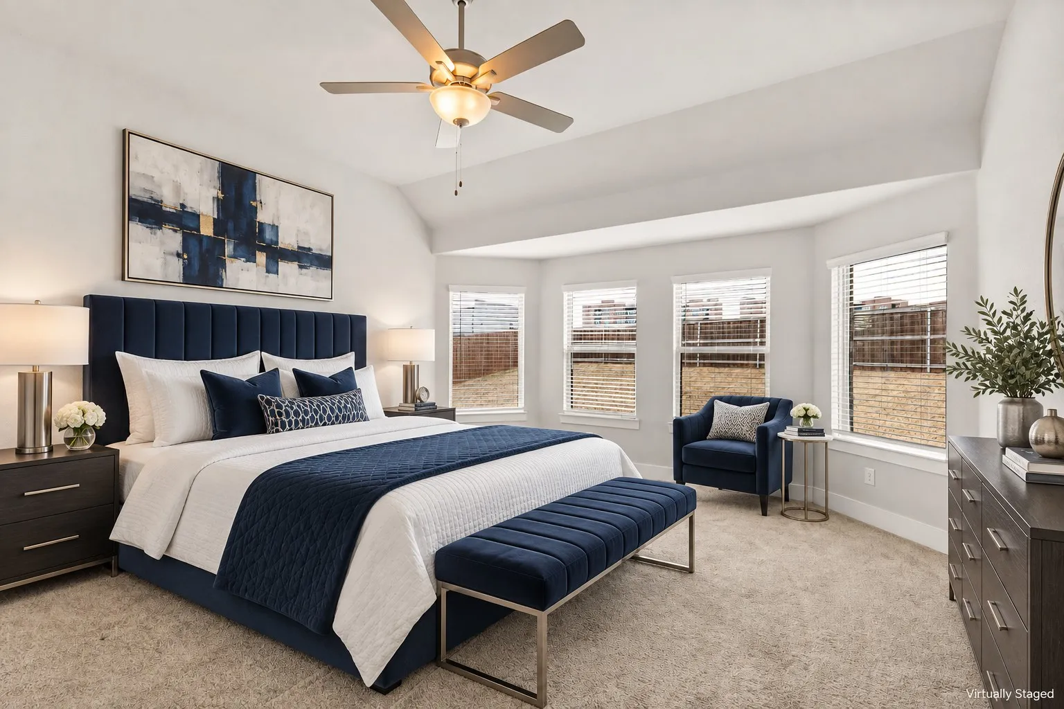 Vaulted ceiling with a ceiling fan, carpet flooring, a bay window with three window units, and window blinds