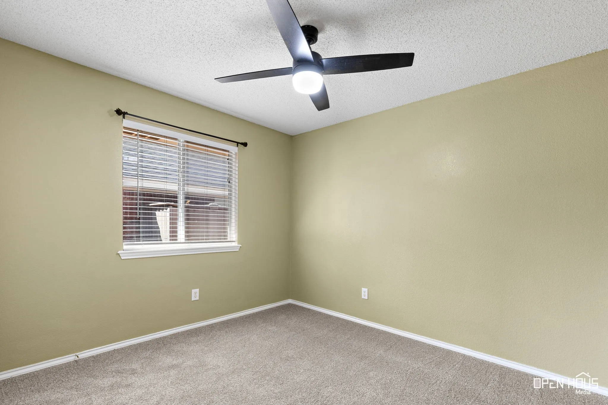 Carpeted flooring, window with blinds, ceiling fan with integrated lighting