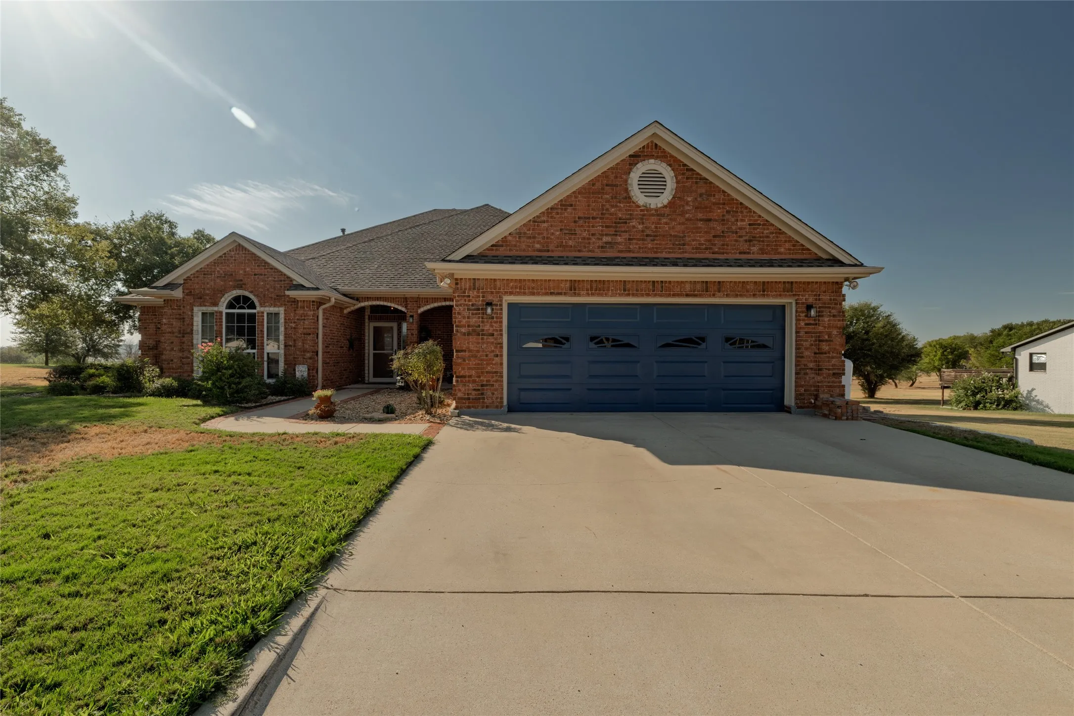 2-car garage with a proper staircase leading to the attic with flooring.