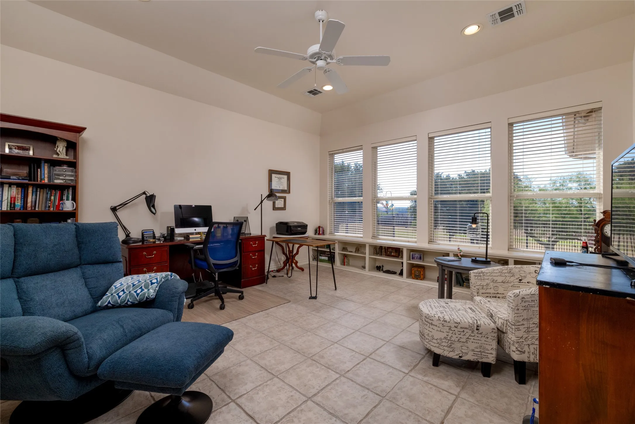 Office or craft room with attached hafl bathroom.